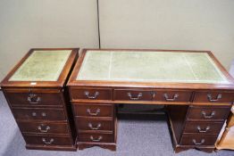 A pedestal desk and a filing cabinet