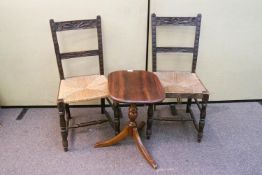 A pair of chairs and a small table