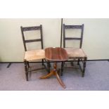 A pair of chairs and a small table