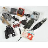 A box of assorted fishing and sporting equipment, including fishing reels, knives,