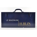 A painted metal case, the cover opening to reveal a magnum of H Blin champagne, 2000 vintage, 12.