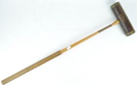 A Slazenger brass bound croquet mallet,