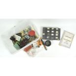 A box of assorted fly fishing tackle, including reels, flies, lures,
