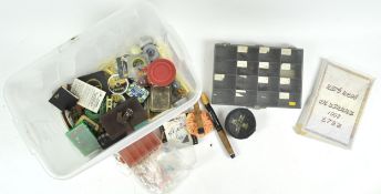 A box of assorted fly fishing tackle, including reels, flies, lures,