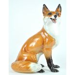 A Ronzan pottery figure of a fox, painted marks,