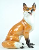 A Ronzan pottery figure of a fox, painted marks,