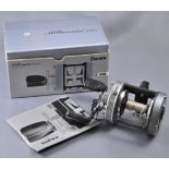 A Daiwa Millionaire 6HM casting reel,