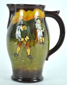 A Royal Doulton terracotta golfing jug, decorated with players in Puritan style dress,