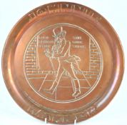A Johnnie Walker pressed copper round advertising tray,