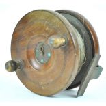 A large hardwood fishing reel,