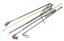 A collection of six assorted riding crops, with one vintage example,