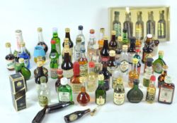 A collection of over 50 beer, spirit and other miniatures, to include Guinness, Gilbeys, Gordons,