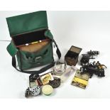 An Efgeeco 'Standard' tackle box containing assorted fixed spool and centre pin reels, nets,