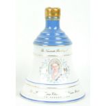 A Wade for Beklls bell whisky decanter for the Queen Mother's 90th Birthday, with contents