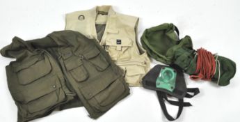 A group of assorted fishing equipment, including fishing waistcoats,