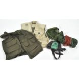 A group of assorted fishing equipment, including fishing waistcoats,