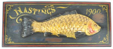 A composite half fish mounted on a painted mahogany board, 'Hastings 1900',