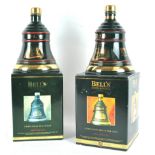 Two boxed Bells porcelain Christmas whisky decanters