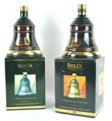 Two boxed Bells porcelain Christmas whisky decanters