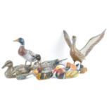 A group of carved wood and composite decoy duck style figures and others, to include a mandarin,