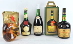 A bottle of Remy Martin fine Champagne Cognac, 70%, together with a bottle of Benedictine,