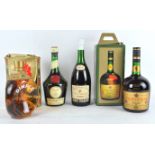 A bottle of Remy Martin fine Champagne Cognac, 70%, together with a bottle of Benedictine,