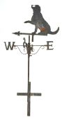 A cast and wrought iron weather vane with an ornament in the form of a seated gun dog,