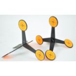 Two metal caltrop shaped shooting targets,