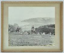 A vintage photograph of the Devon and Somerset Stag Hounds, titled and signed to the mount,