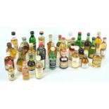 A collection of over thirty spirit miniatures, to include Grants whisky, Tamdiau 10 year old whisky,