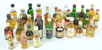 A collection of over thirty spirit miniatures, to include Grants whisky, Tamdiau 10 year old whisky,