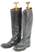 A pair of traditional black leather riding boots,