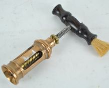 A copper, brass and lignum vitae patent Vulcan corkscrew, No 434, with cork brush to the handle,