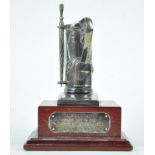 A silver plated golfing trophy, in the form of a golf bag with removable umbrella,