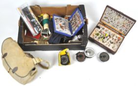 A box of fly fishing equipment,