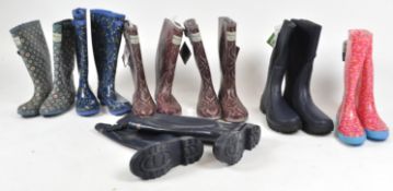 A group of assorted decorated Wellington boots in various sizes