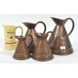 Four copper ale measures and a Bells jug,