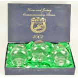 A boxed gift set of three horse and jockey commemorative brandy glasses,