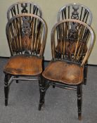 A set of four oak wheel back chairs,