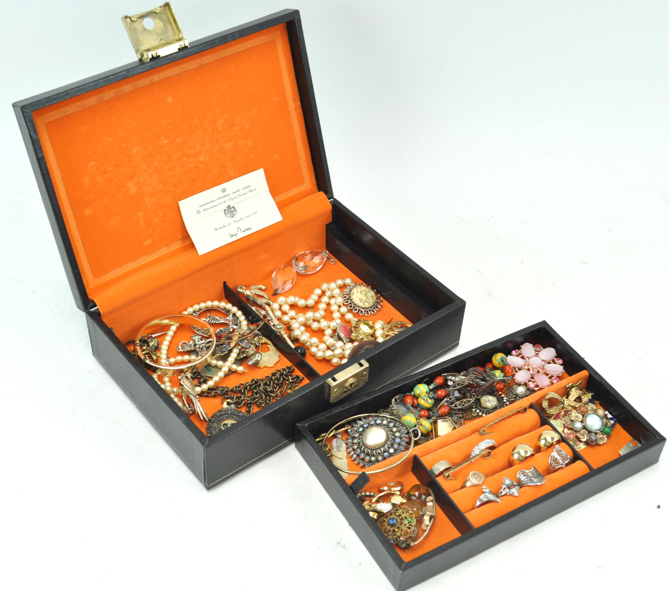 A large black Swedish jewellery box of vintage jewellery