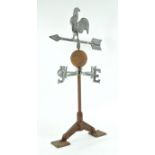 A mixed metal weather vane with cockerel motif,