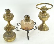 Three brass oil lamps and another