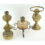 Three brass oil lamps and another