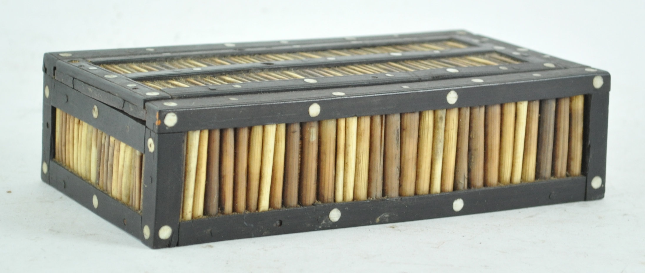 A porcupine quill and an ebony and bone inlaid box,