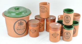 A collection of terracotta kitchen containers,