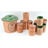 A collection of terracotta kitchen containers,