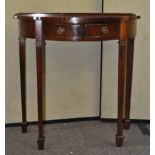 A mahogany side table with shaped front,