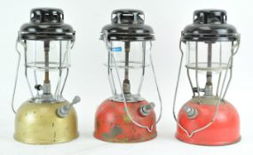 Three metal pump action storm lanterns,