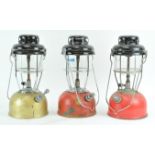 Three metal pump action storm lanterns,