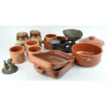 A set of scales and some terracotta kitchen containers